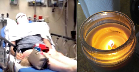 woman burns candle FI